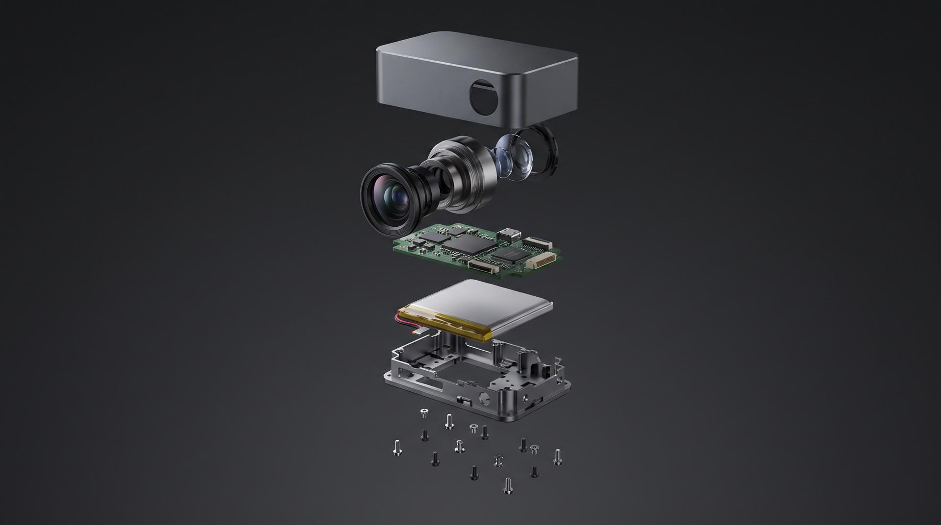 An exploded view of a compact camera device with the aluminum shell, lens assembly, circuit board, battery, inner frame and screws floating apart in a vertical stack on a dark background