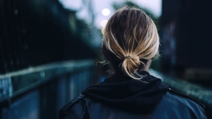 Gif example 7 glitch overlay of a woman on a bridge